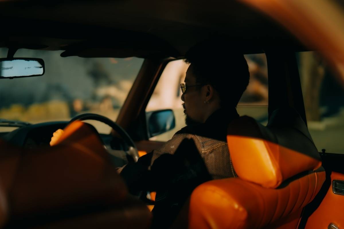 A man in a car | Skylum Blog

