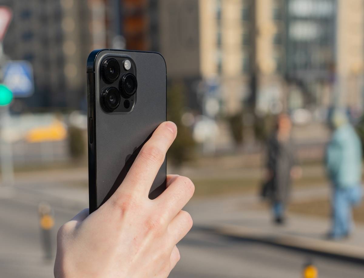 An iPhone in a guy's hands | Skylum Blog