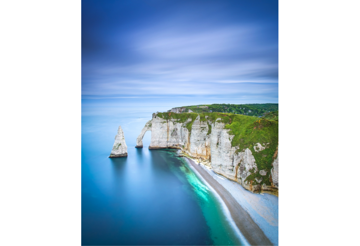 Coastal cliffs and turquoise sea under a blue sky | Skylum Blog

