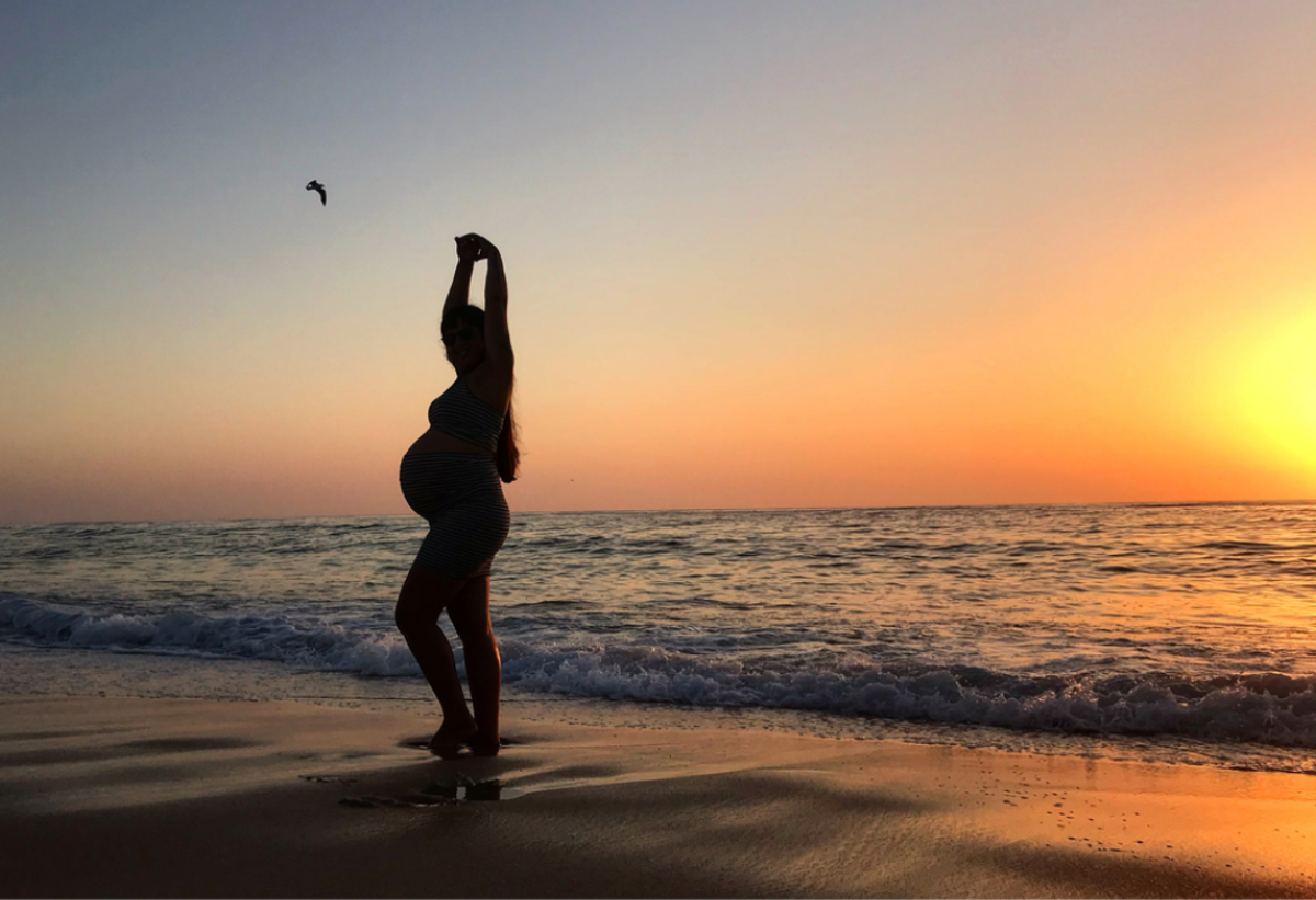 Pregnant woman silhouette walking at sunset | Skylum Blog

