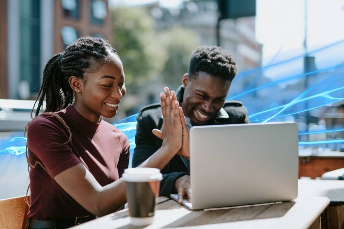 A couple looking at photos on a laptop | Skylum Blog

