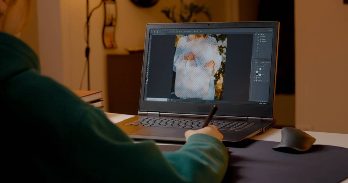 Photoshop layers panel open beside a portrait of a woman in a sheer white sweater